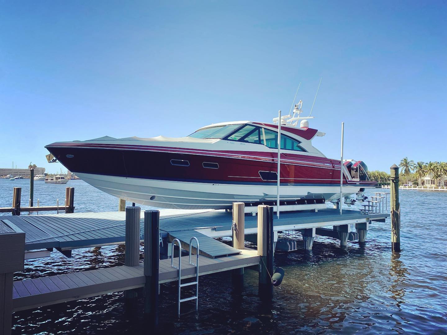Neptune 4-post boat lift supporting a center console boat
